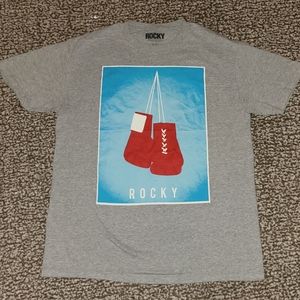 Rocky Tee Shirt. Size Large. Commemorating all of the Rocky Movies.